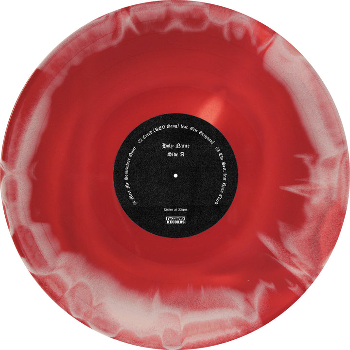 A red and white marbled Limited Edition 2xLP vinyl by HolyName, featuring a black center label with white text displaying album details, a parental advisory warning, and marking it as the Triodion release.