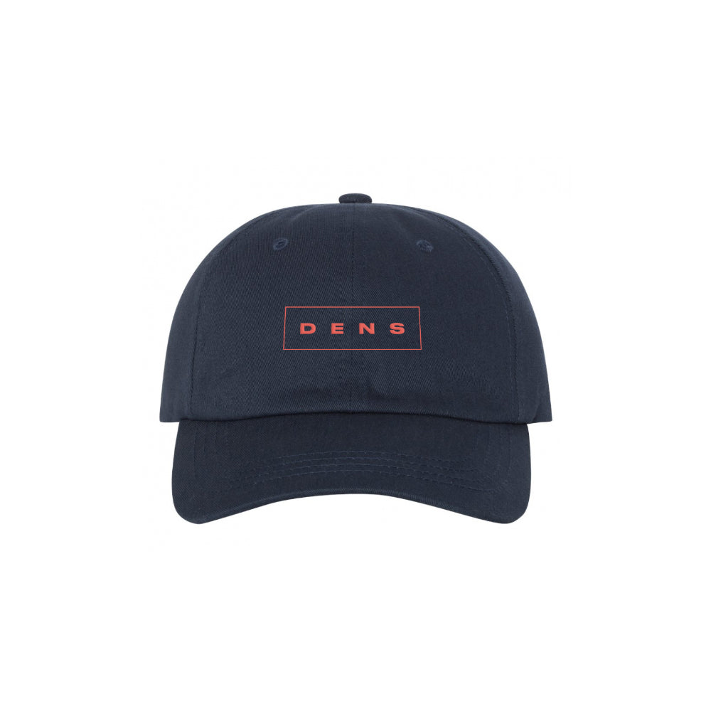 A DENS navy blue baseball cap with a red rectangular patch on the front displaying DENS in capital letters, shown against a white background.