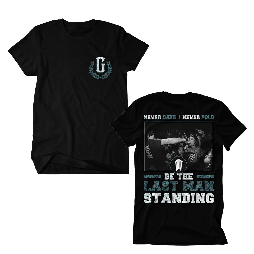 Two black Gideon Dri-Power T-Shirts with a small G and laurel wreath on the front. Made from 50/50 cotton-polyester for moisture management. Back features a concert crowd and bold text: NEVER CAVE | NEVER FOLD, BE THE LAST MAN STANDING.