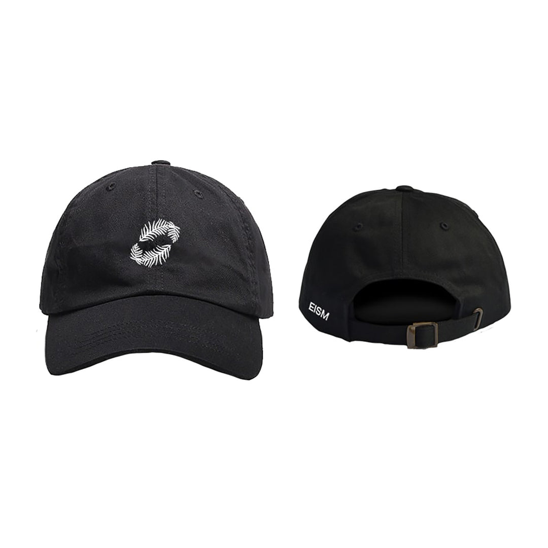 Black dad hat by Everything In Slow Motion shown front and back: features a white embroidered circular geometric design on the front, bio-washed cotton back with adjustable strap, and small “EISM” text on the side.
