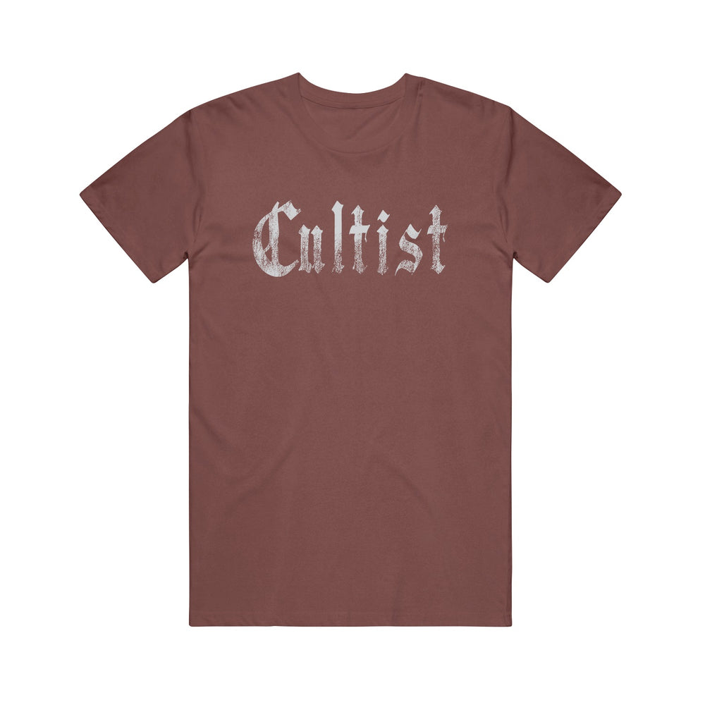 A brown Cultist Comfort Colors t-shirt featuring "Cultist" in large, distressed white Gothic-style letters across the chest, displayed flat on a white background.