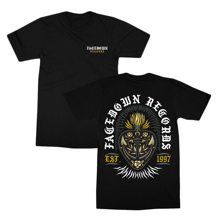 Black t-shirt with Facedown Records text on the front chest. Back features a large stylized shield, anchor, crown, and sunburst design with Facedown Records Est. 1997 in bold white and yellow lettering.