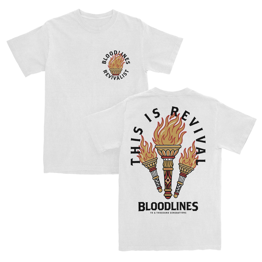 White t-shirt crafted from 100% cotton with a relaxed fit, featuring BLOODLINES REVIVALIST and a torch on the front. The back showcases three flaming torches, THIS IS REVIVAL in large text above, and BLOODLINES in smaller print underneath—a true heavyweight T-shirt built for comfort and style.