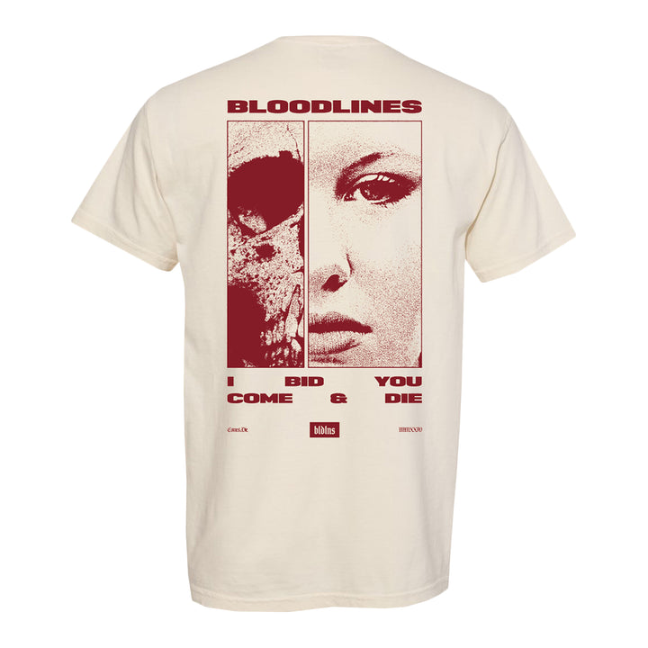 Back of a cream, garment-dyed Comfort Colors T-shirt made from soft ring-spun cotton with bold red graphics: a skull on the left, a woman’s face on the right. Text reads BLOODLINES. I BID YOU COME & DIE. Logos and small text appear at the bottom.