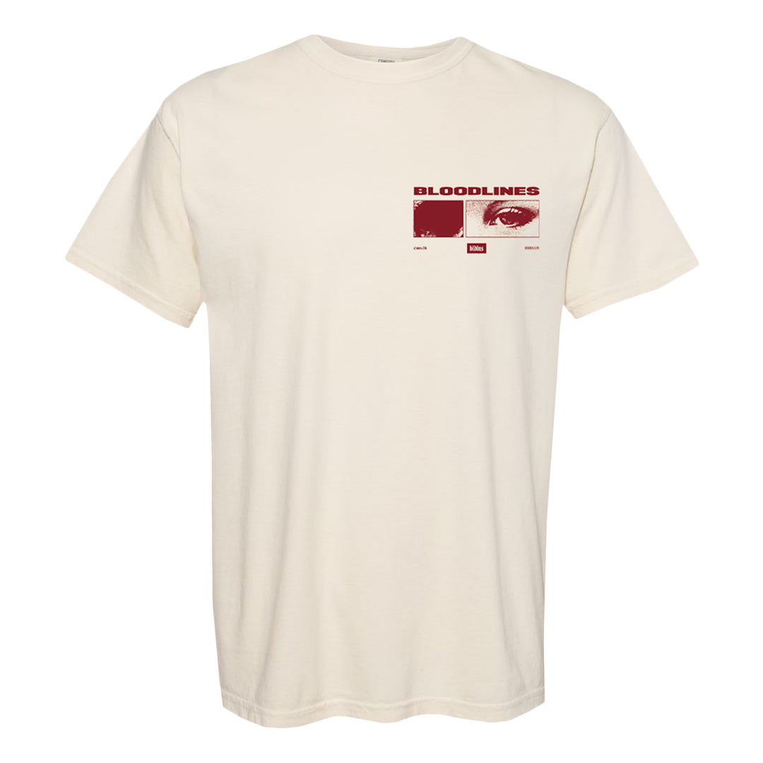 Cream-colored garment-dyed t-shirt with a red graphic on the chest featuring the word BLOODLINES, an eye, a fingerprint, and small text and boxes underneath each image. Made from soft ring-spun cotton for added comfort.