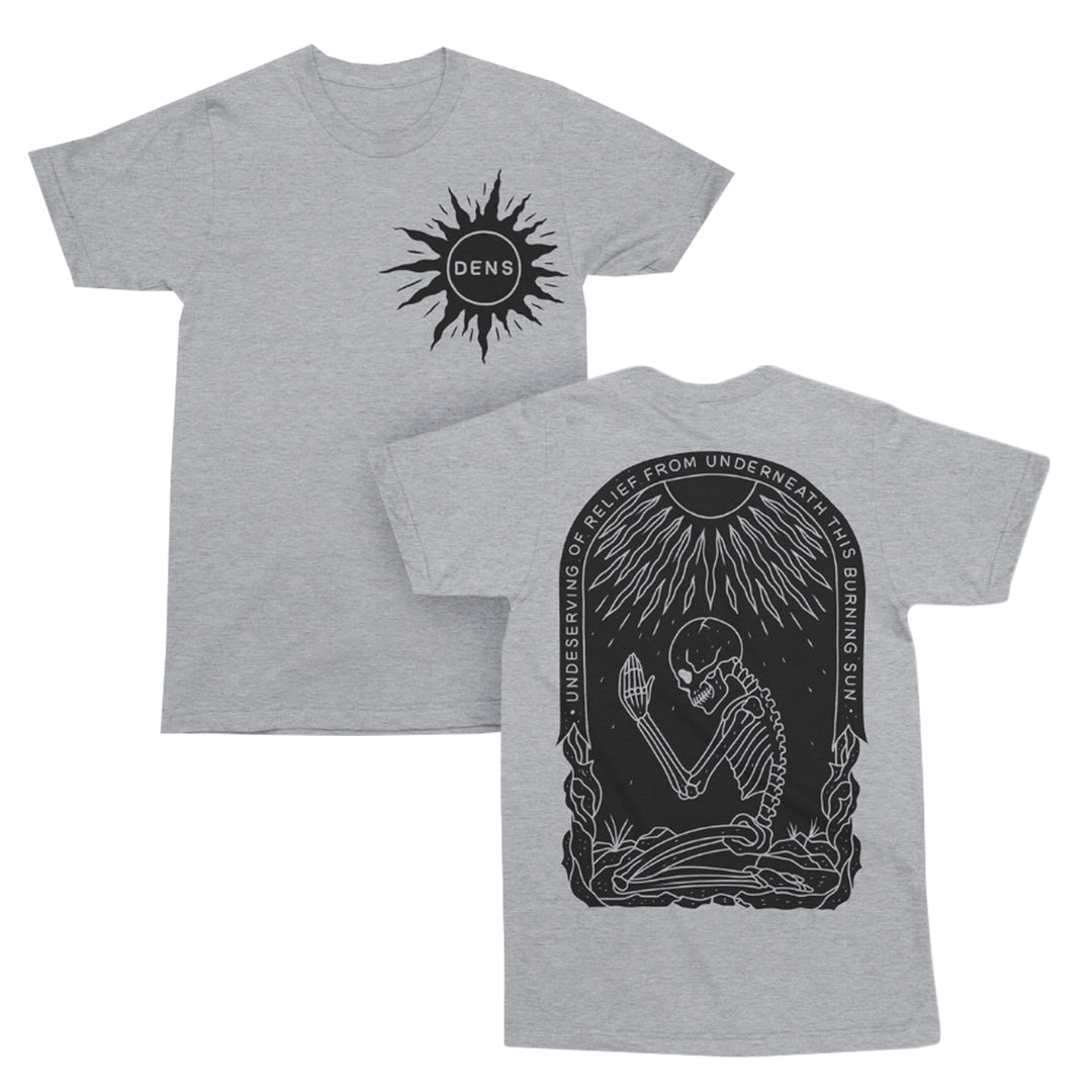 A gray T-shirt with a black sun and DENS logo on the front. The back features a skeleton sitting under a radiant sun with the text, UNDESERVING OF RELIEF FROM UNDERNEATH THIS BURNING SUN..