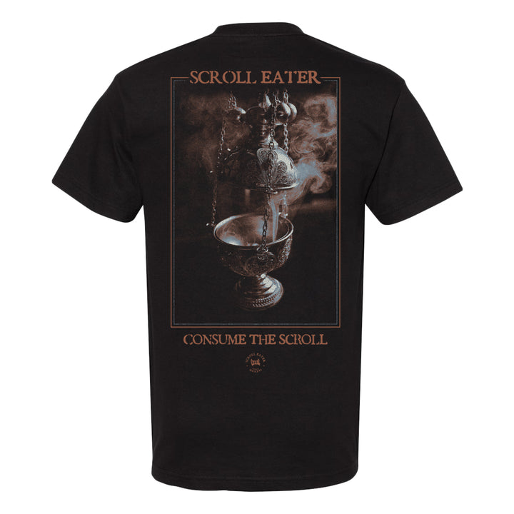 Black heavyweight T-shirt, crafted from 100% cotton, featuring an ornate incense burner emitting smoke, with the text SCROLL EATER above and CONSUME THE SCROLL below the image in a stylized font. Inspired by the quality and fit of American Apparel 1301.