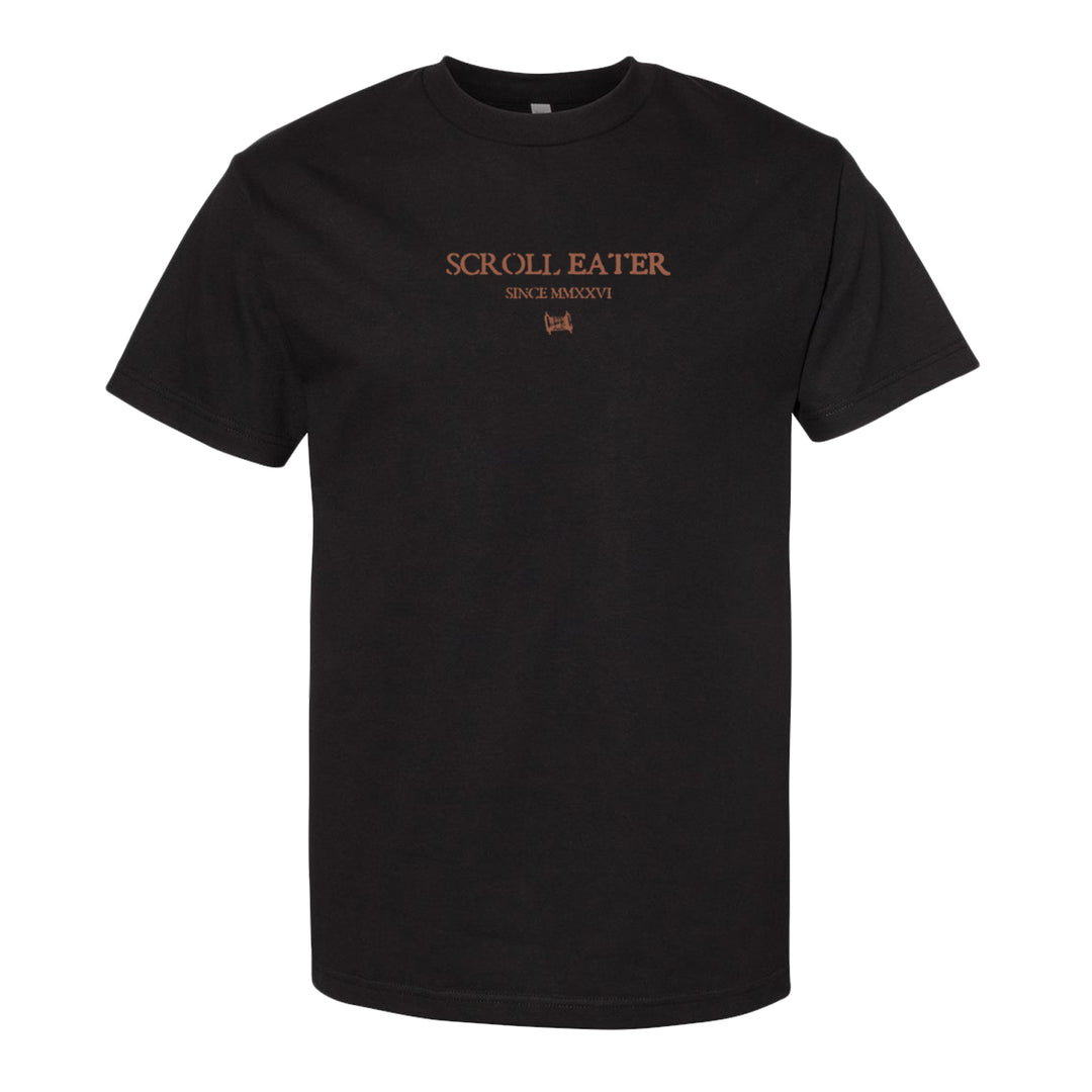 Black t-shirt crafted from 100% cotton with the words SCROLL EATER, SINCE MMXVI, and a small graphic printed in orange on the front center. Inspired by classic heavyweight t-shirts like the American Apparel 1301 for a comfortable and lasting fit.
