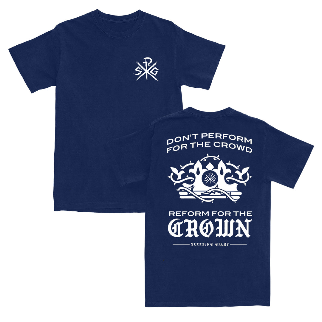 Navy blue T-shirt crafted from 100% cotton with a relaxed fit, featuring a small white logo on the front left chest and a large white crown graphic on the back. Back text reads: DONT PERFORM FOR THE CROWD, REFORM FOR THE CROWN, SLEEPING GIANT. Inspired by American Apparel quality for ultimate comfort and style.
