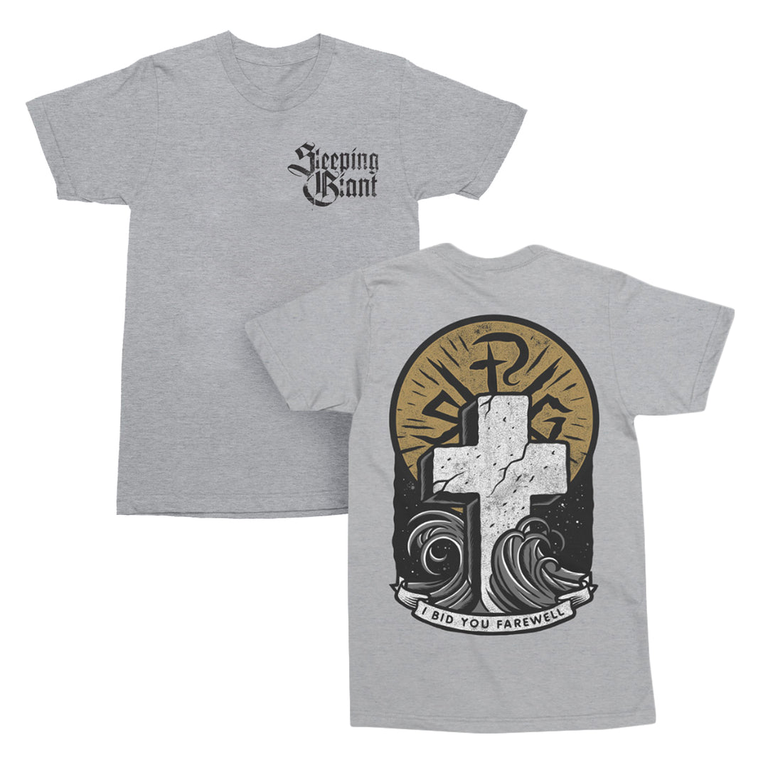 Gray American Apparel t-shirt with Sleeping Giant text on the front left chest. The relaxed fit t-shirt features a large cross, sun rays, waves, and a banner reading I BID YOU FAREWELL on the back in a bold black, white, and gold design. Crafted from a soft cotton polyester blend for comfort and style.