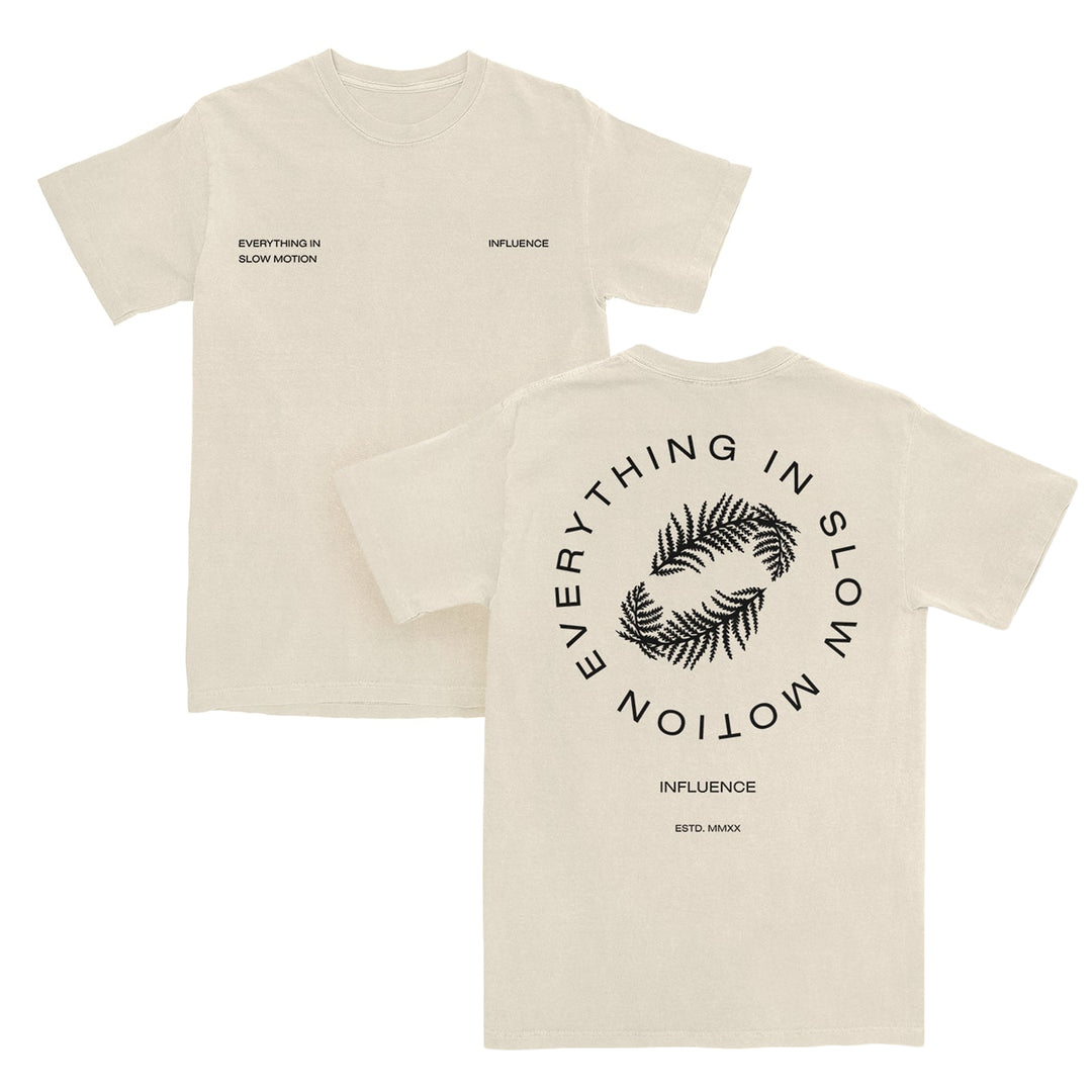 Two beige Pacific Sport T-Shirts crafted from 100% cotton. Front: EVERYTHING IN SLOW MOTION on left chest, INFLUENCE on right. Back: Two palm leaves encircled by EVERYTHING IN SLOW MOTION. Bottom: INFLUENCE and ESTD. MMXX details add a unique touch, while the tear-away label ensures comfort all day long.
