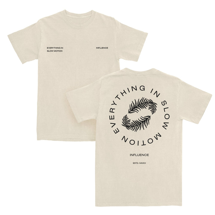 Two beige Pacific Sport T-Shirts crafted from 100% cotton. Front: EVERYTHING IN SLOW MOTION on left chest, INFLUENCE on right. Back: Two palm leaves encircled by EVERYTHING IN SLOW MOTION. Bottom: INFLUENCE and ESTD. MMXX details add a unique touch, while the tear-away label ensures comfort all day long.