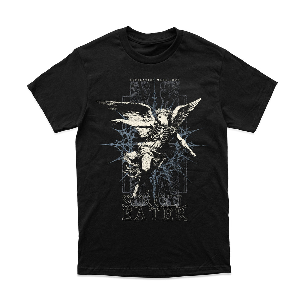 A relaxed fit black t-shirt featuring a graphic of a winged skeletal figure in front of a blue star-shaped design, with the text REVELATION MADE LOUD and SCROLL EATER.