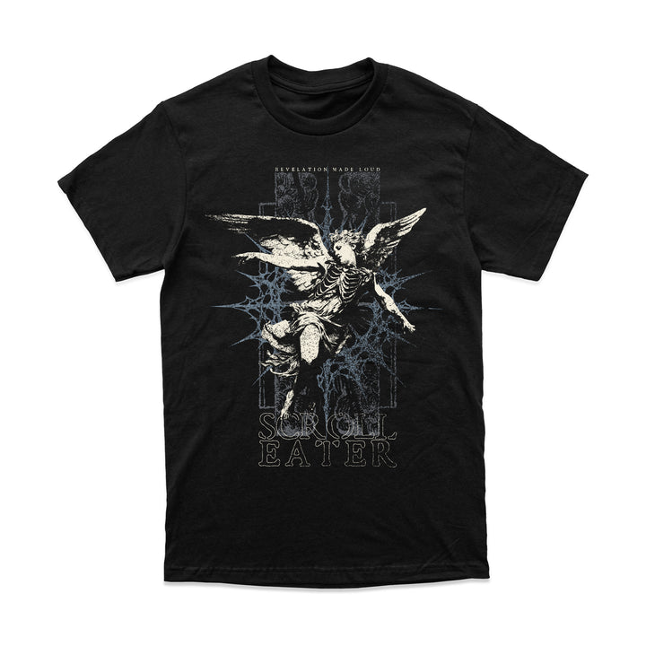 A relaxed fit black t-shirt featuring a graphic of a winged skeletal figure in front of a blue star-shaped design, with the text REVELATION MADE LOUD and SCROLL EATER.