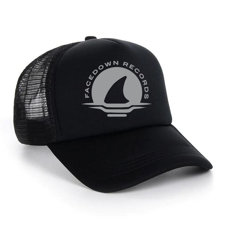 A black mesh trucker hat by Facedown Records features a shark fin logo and Facedown Records printed in gray on the front panel.