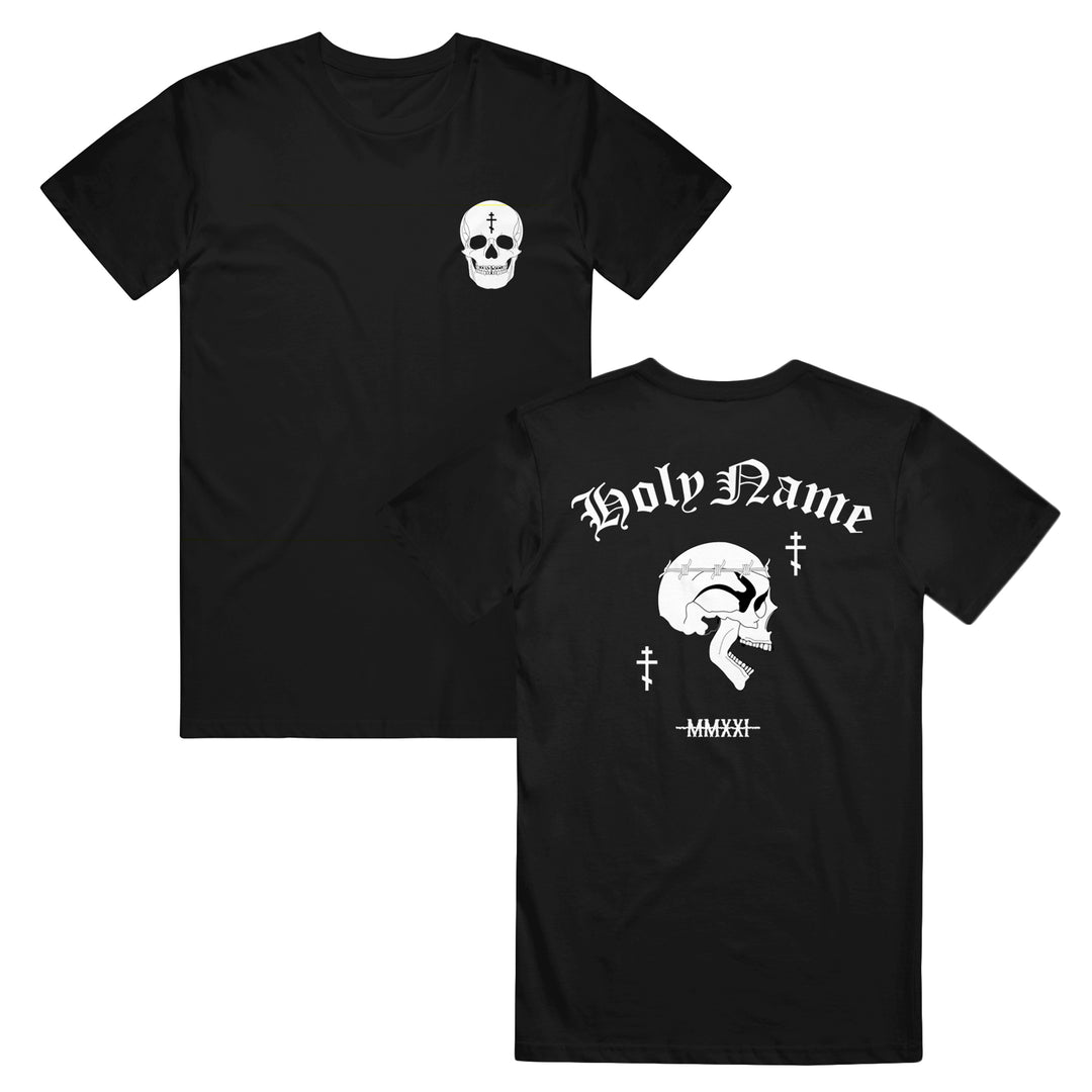 Black t-shirt with a white skull on the front left chest. The back features a large skull, Holy Name text above, Roman numerals below, and two small cross symbols. Crafted from soft ring-spun cotton in a modern classic fit, this design offers both comfort and style—perfectly suited for fans of Gildan Softstyle T-Shirts.
