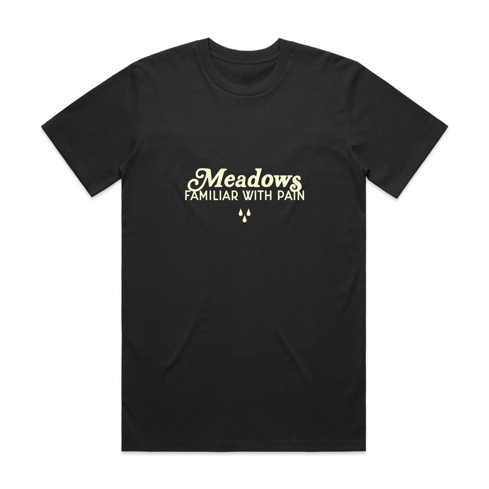 Black classic fit t-shirt made from 100% cotton, featuring the words Meadows Familiar With Pain in cream-colored text and three small teardrop shapes underneath the text.