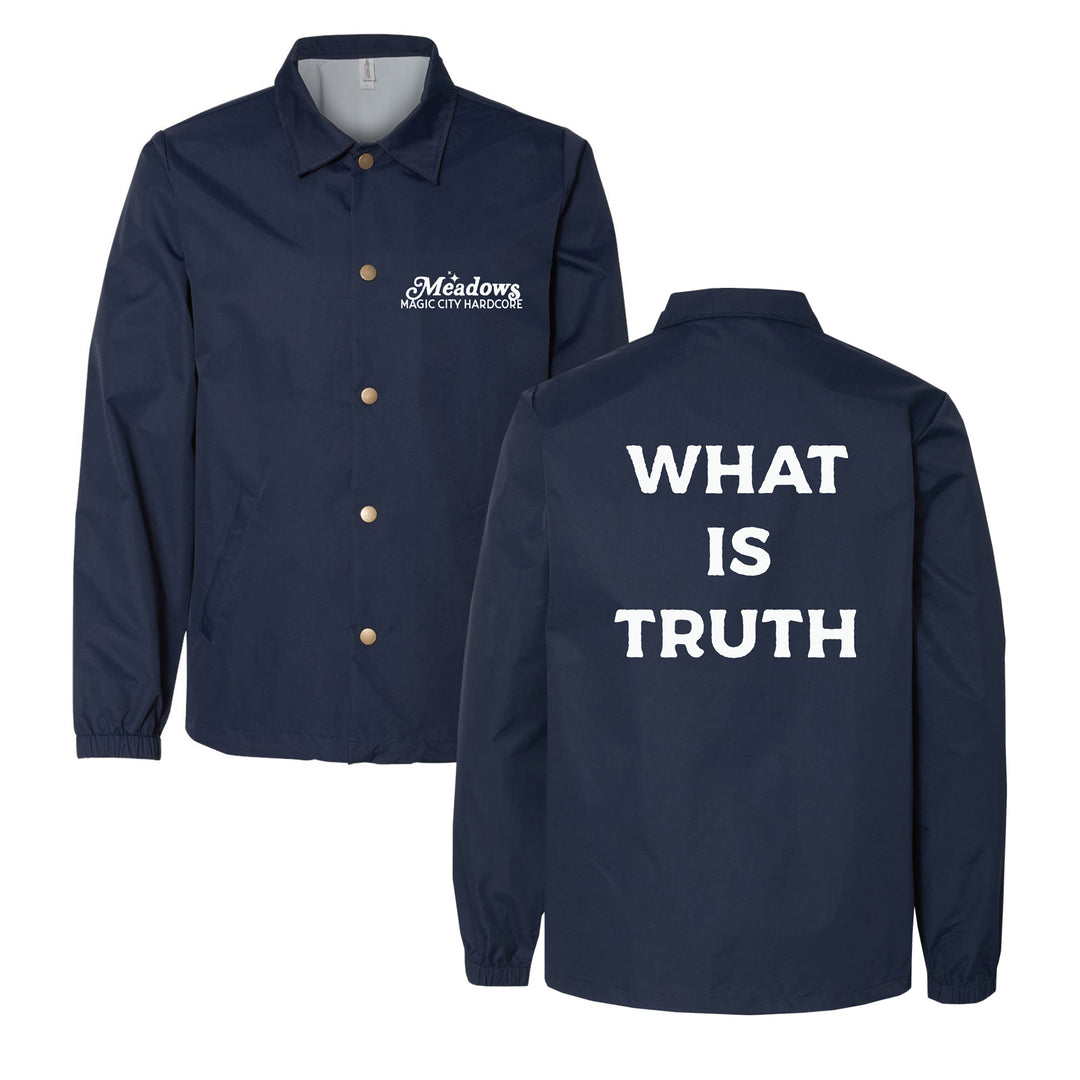 A navy blue water resistant windbreaker with Meadows Mercy City Maddock on the front left chest and WHAT IS TRUTH printed in bold white letters across the back.