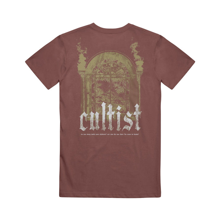 A brown Cultist Comfort Colors shirt with a faded, vintage-style graphic of an ornate window and columns, and “cultist” boldly printed in large white letters across the back.